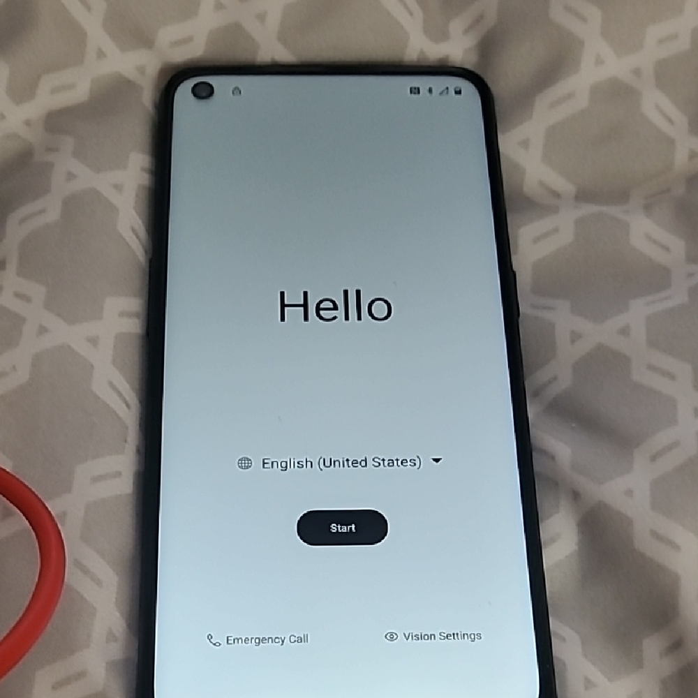 OnePlus Phone with Red Cable and Charger
